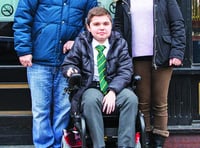 Gaming centre presents Woking teenager with powered wheelchair