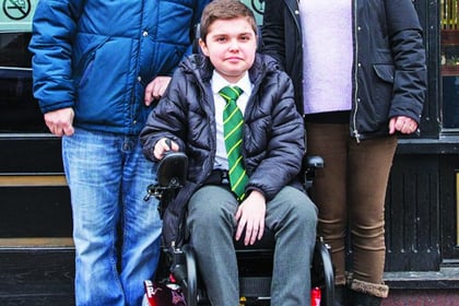 Gaming centre presents Woking teenager with powered wheelchair