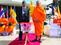 Woking temple monks host alms-giving ceremony