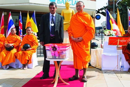 Woking temple monks host alms-giving ceremony
