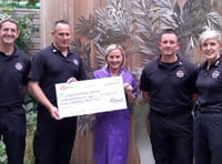 Firefighters present £1000 cheque to hospice