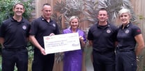 Firefighters present £1000 cheque to hospice