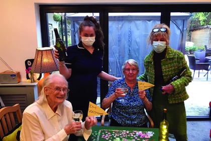 Care home residents celebrate jabs with a party