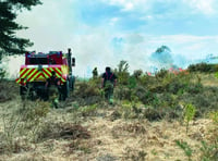 Firefighters rush to douse flames on common