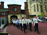 Scouts march into castle to receive their royal awards