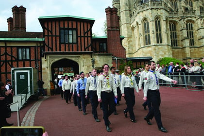 Scouts march into castle to receive their royal awards