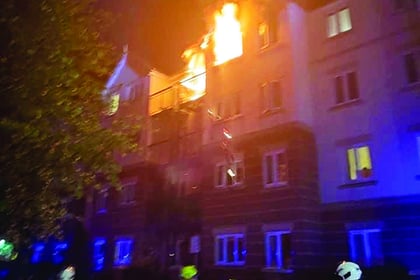 Evacuation as fire grips flats