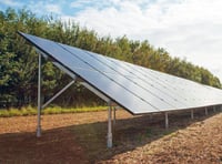 Plans for field of solar panels to power farm office and cottage