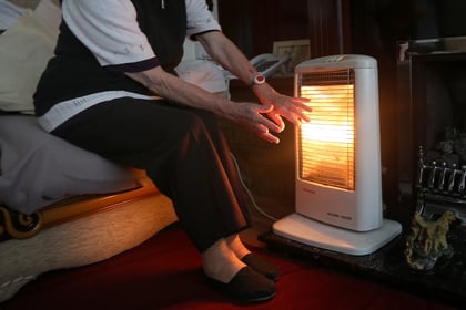 Almost 100 elderly people living alone in Woking have no central heating