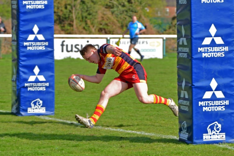 Finn Livingstone scores under the posts for Chobham against Cullompton.