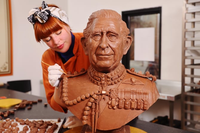 ### Strictly Embargoed Until 00:01 on 26/04/2023 ###
*** FREE FOR EDITORIAL USE ***  EDITORIAL USE ONLY

A bust of King Charles III made entirely from Celebrations chocolates is unveiled ahead of the Coronation. The sculpture, commissioned by the chocolate brand, took four weeks to create and weighs over 23kg â the equivalent of 2,875 individual Celebrations chocolates. 

Photo credit should read: Joe Pepler/Pinpep