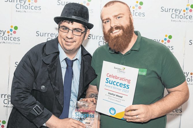 Noah Humphries receives the Surrey Choices Celebrating Success award on behalf of Woking-based The Useful Wood Company