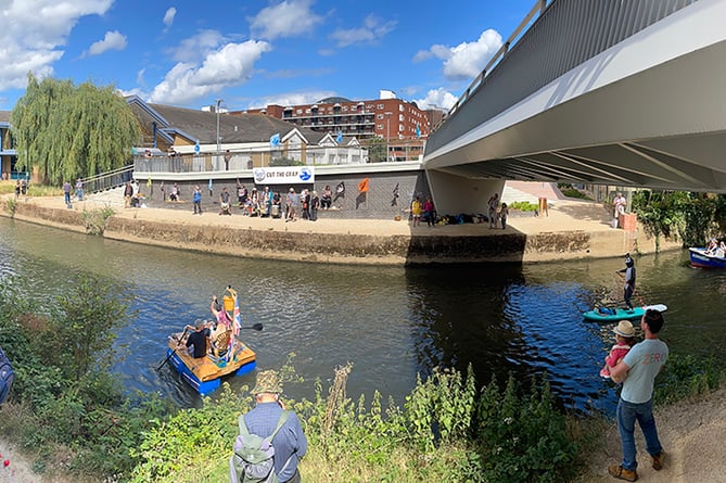 Extinction Rebellion protesters line up opposite Guildford Lions’ Big River Race charity fundraising event 