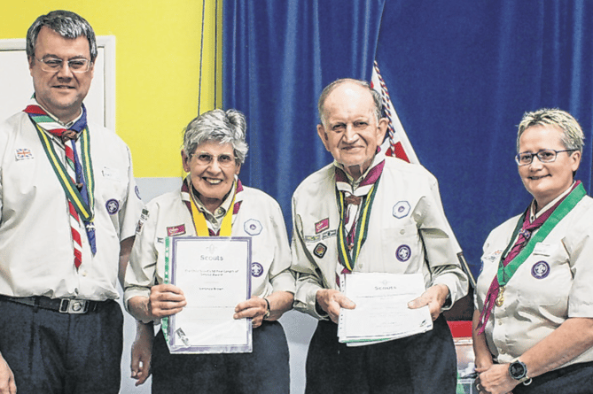 John and Veronica Brown with Woking DC, Kath Brown and deputy county Scout commissioner Phil Currie