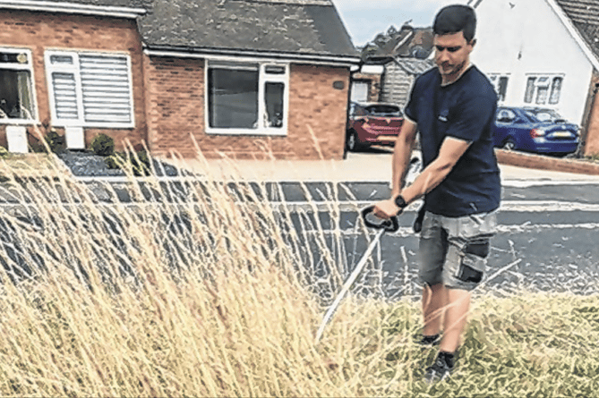 Pyrford residents cut their local verges after delays by the council