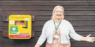 Councillors help fund new life-saving device at bowls club