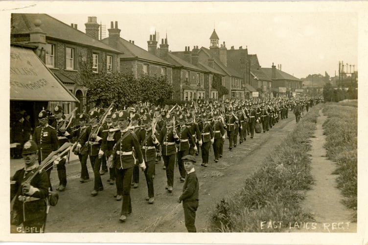 A postcard showing the East Lancashire Regiment in Goldsworth Road, 1911