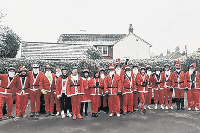 Last year’s Santas braved the cold for Woking hospice