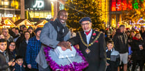 Hasselbaink makes star turn at Woking Christmas tree lights switch on