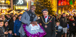 Hasselbaink makes star turn at Woking Christmas tree lights switch on