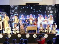 Chobham reception pupils take first steps on stage by singing carols