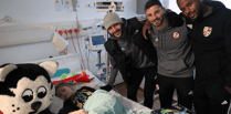 Footballers raise sick kids' spirits with annual visit to hospitals