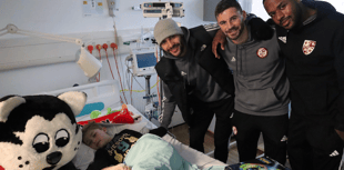 Footballers raise sick kids' spirits with annual visit to hospitals