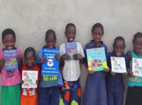 Woking District Rotarians give £2,000 to Africa literacy charity