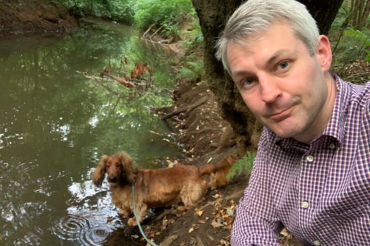 Will Forster and his dog Toffee by the Hoe Stream