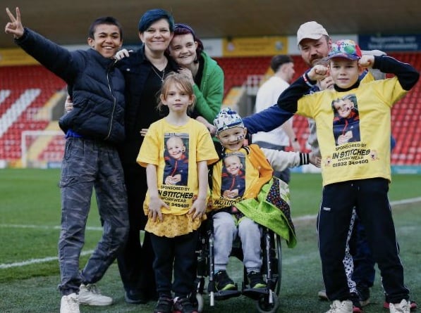 Cain Critcher with his mum Shaney and dad Andy with brothers and sisters, from left, Riley, Elise, Caitlyn and Romeo