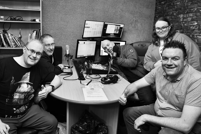 Simon, Shay, James, Emma, a Sunnybank volunteer, and Jon at the Surrey Hills Community Radio studio in Leatherhead