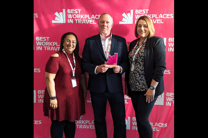 Global Travel Management team with their award 