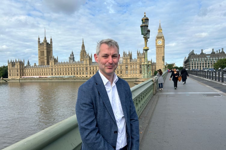 Mr Forster outside the Houses of Parliament