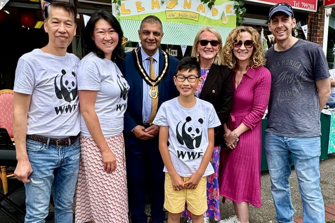 Left to right: Jacob's father Alan and mother Soo, Saj Hussain, Jacob, Mrs Grace, Mrs Pickard and Mr Ben Davies 