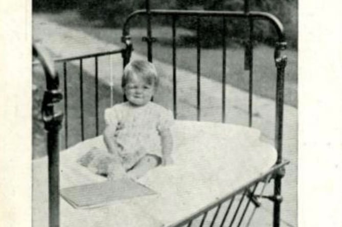 Cot at The Little Folks Home bought by donated used stamps