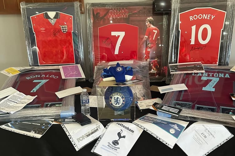 Auction items at football tournament and fun day in aid of Cain Critcher, 6, who has cancer