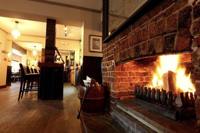 A fire is kept going in the cooler months, adding a cosy and warm atmosphere 