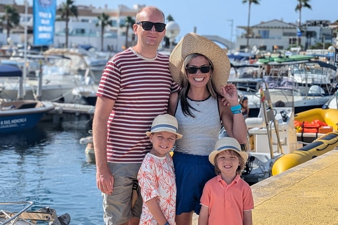 Leukaemia survivor George Peers with dad James, mum Clare, and little brother Henry