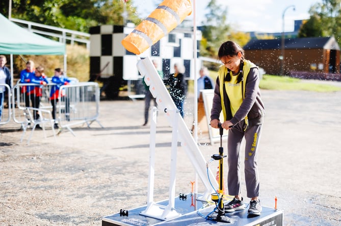 Brownie launching a water rocket at Brooklands Museum