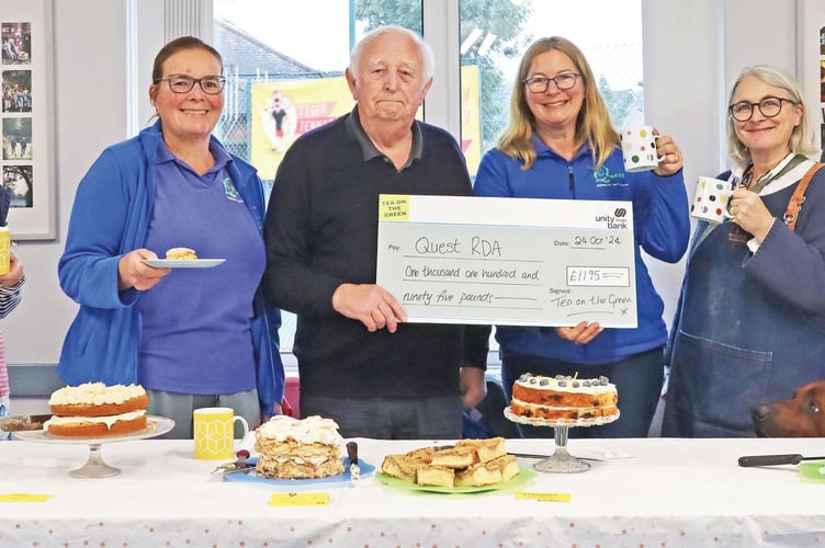 Chobham Parish Council chairman Les Coombs presents the Tea on the Green cheque to Fiona Davidson from Quest RDA. Also pictured (from left) are afternoon tea volunteers Jennie Smith, Quest RDA chair Julie Jones and parish councillors Emma Kennedy and Amy Moqbel 