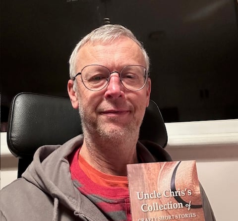 Pete Frost with his short story book