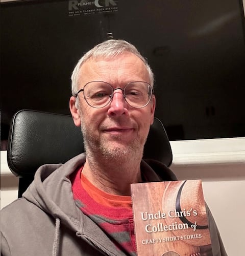 Pete Frost with his short story book