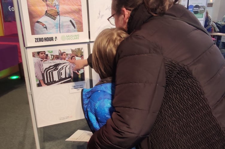 A family takes a closer look at the details on display 